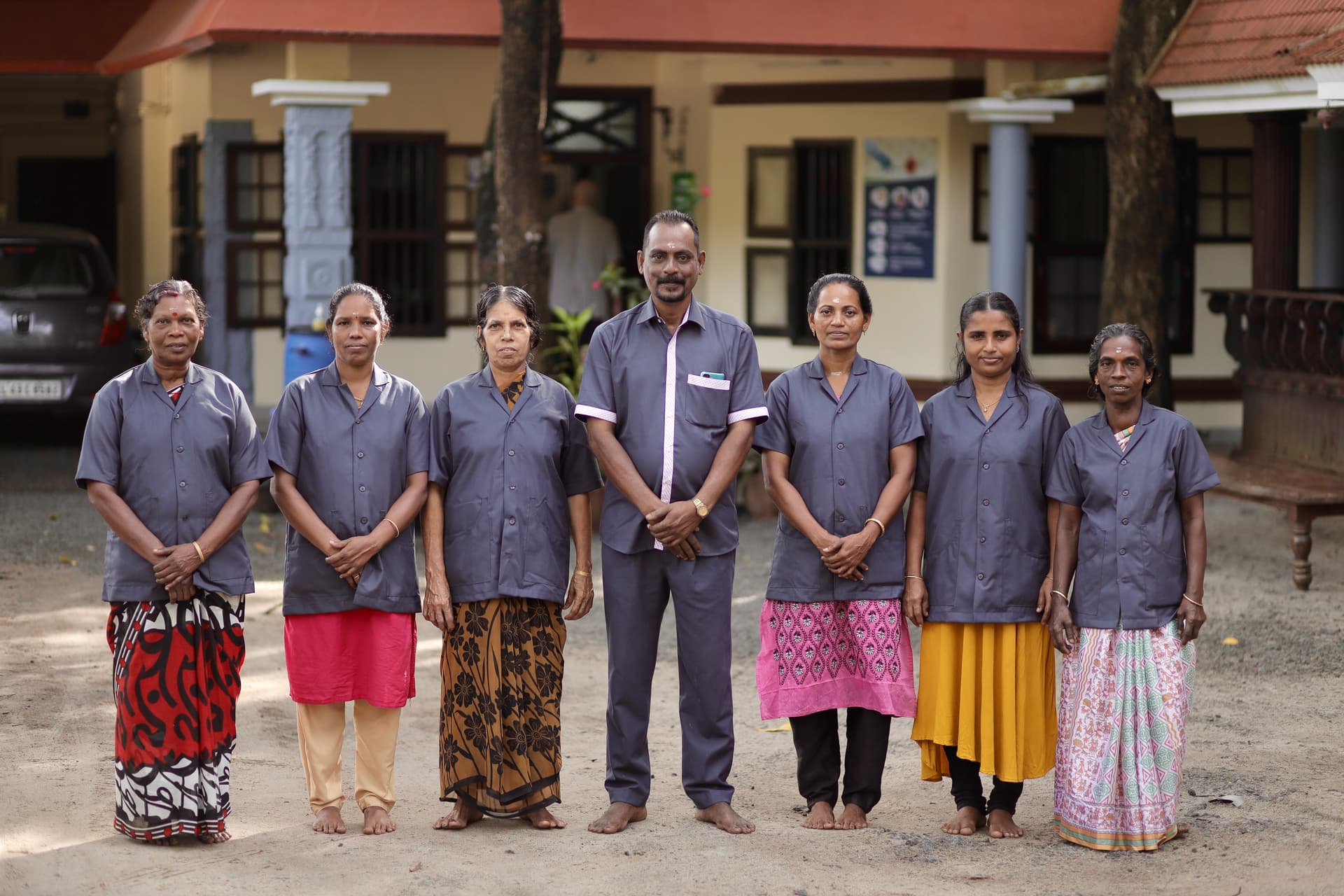Friendly canteen staff preparing nutritious Ayurvedic meals at Agasthya hospital