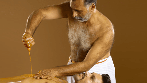 Pizhichil Ayurvedic oil massage therapy for arthritis and joint pain relief