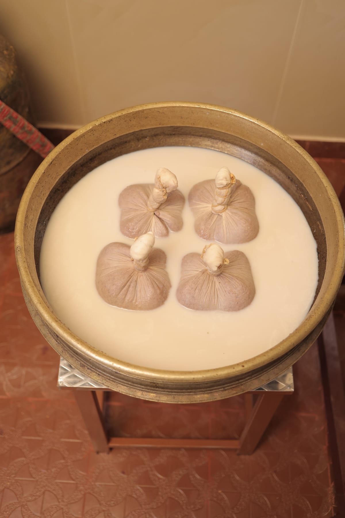 Njavarakizhi herbal rice bolus massage for muscle strengthening and nourishment