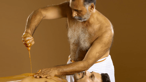 Pizhichil Ayurvedic oil massage therapy for arthritis and joint pain relief